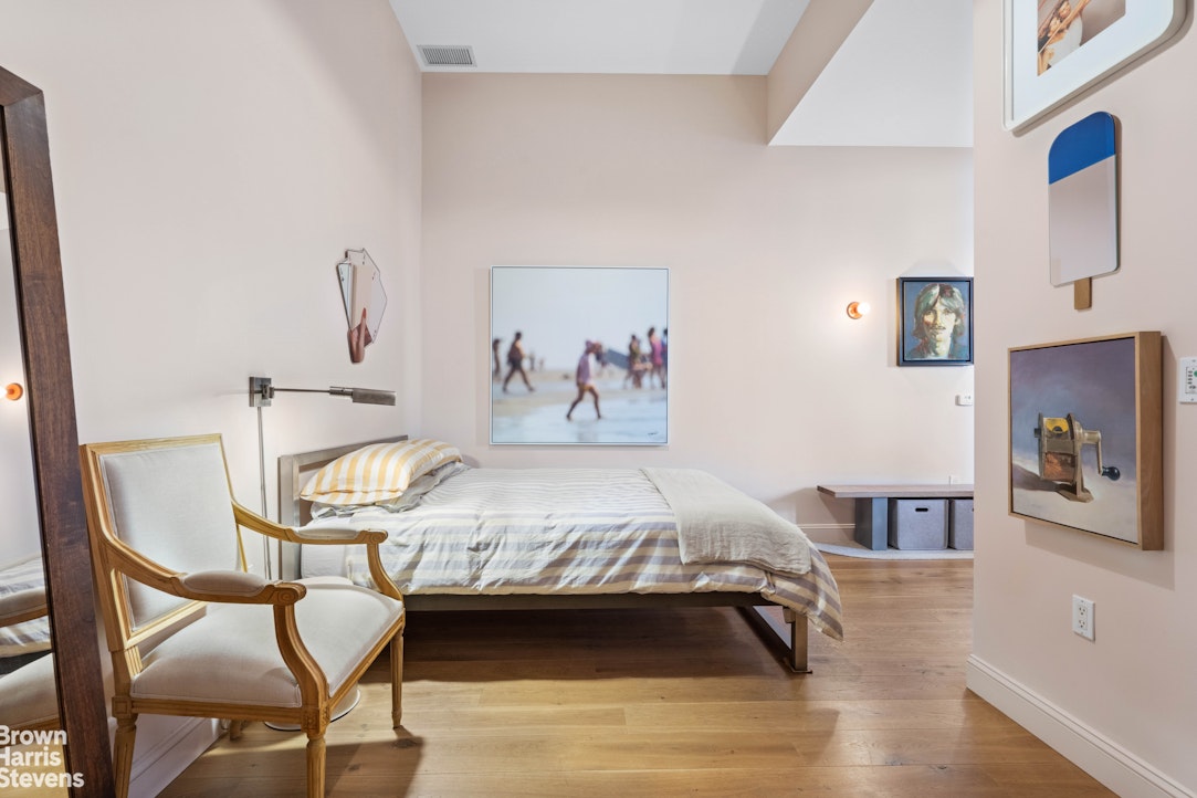 220 West 148th Street, Unit 4B Manhattan, NY 10039 - Photo 4 of 15 a bedroom with a bed and wooden floor