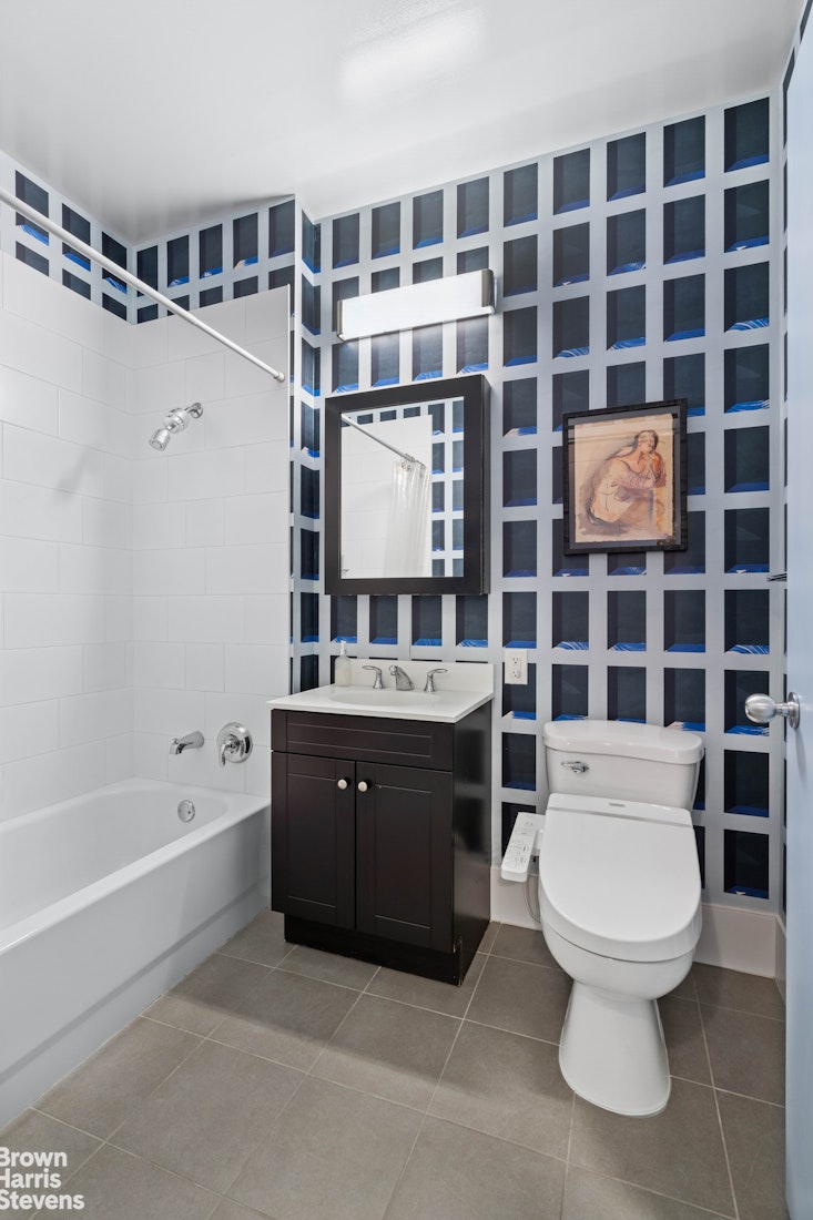 220 West 148th Street, Unit 4B Manhattan, NY 10039 - Photo 8 of 15 a bathroom with a toilet a sink and shower