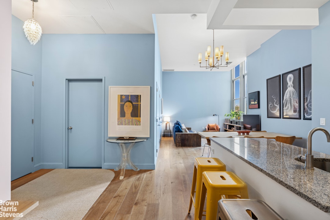 220 West 148th Street, Unit 4B Manhattan, NY 10039 - Photo 9 of 15 a living room with furniture and a chandelier