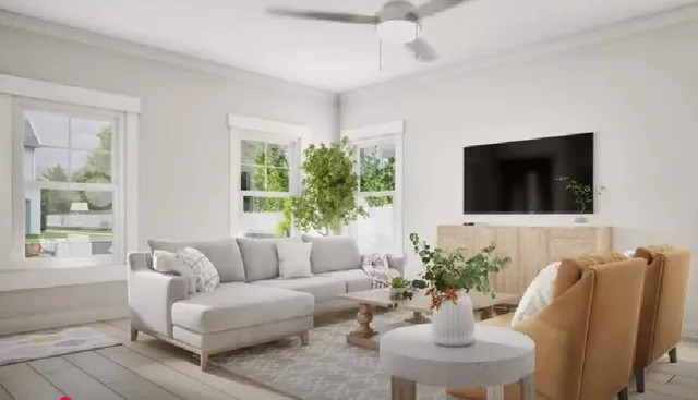 a living room with furniture a potted plant and a flat screen tv