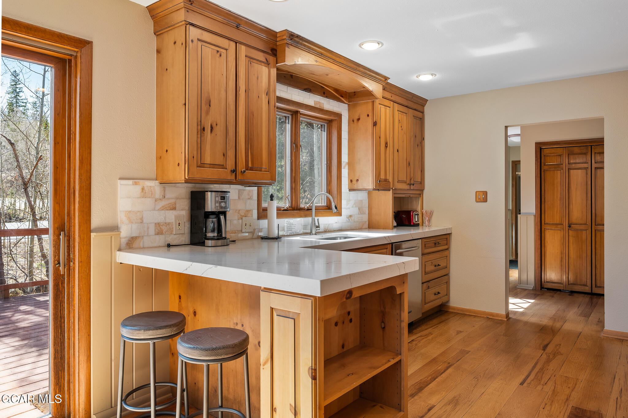 614 Vasquez Road Winter Park, CO 80482 - Photo 12 of 52 a kitchen with stainless steel appliances granite countertop a stove a sink and a refrigerator