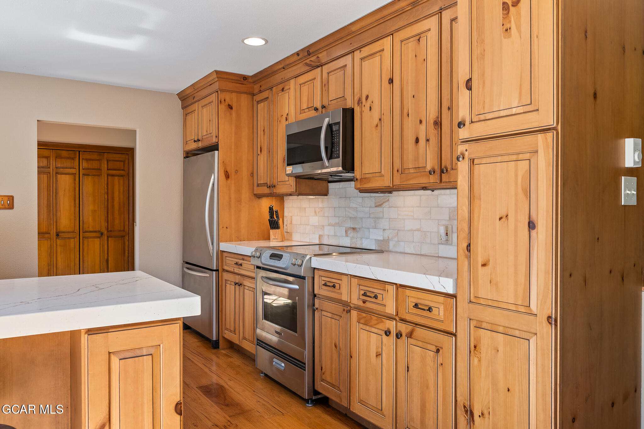 614 Vasquez Road Winter Park, CO 80482 - Photo 13 of 52 a kitchen with stainless steel appliances granite countertop a stove a sink and a refrigerator
