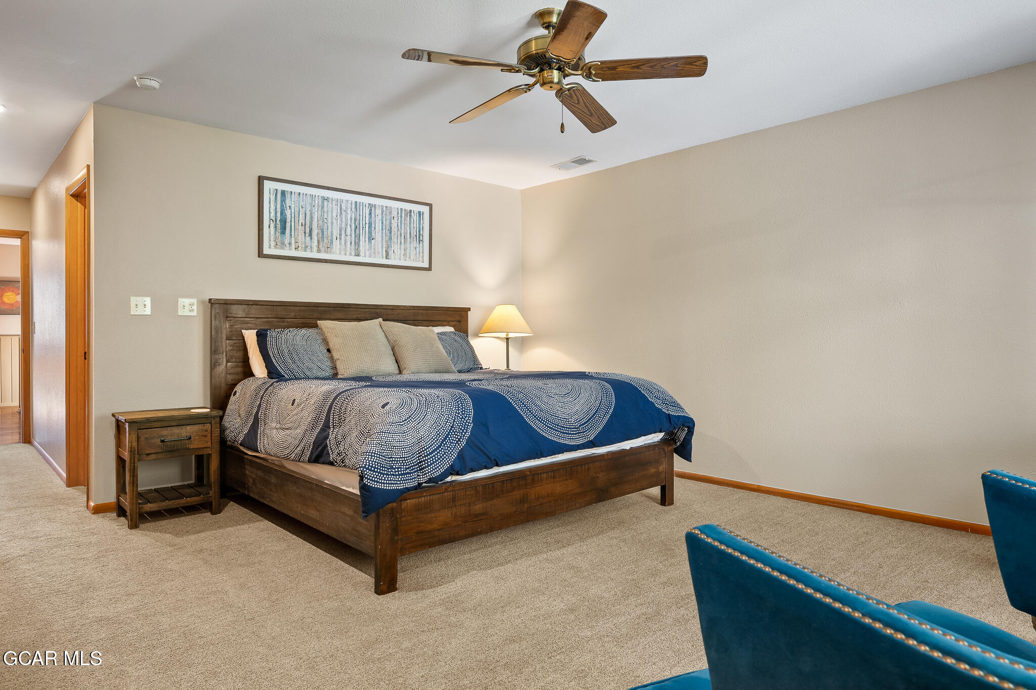 614 Vasquez Road Winter Park, CO 80482 - Photo 22 of 52 a bed sitting in a room next to a lamp