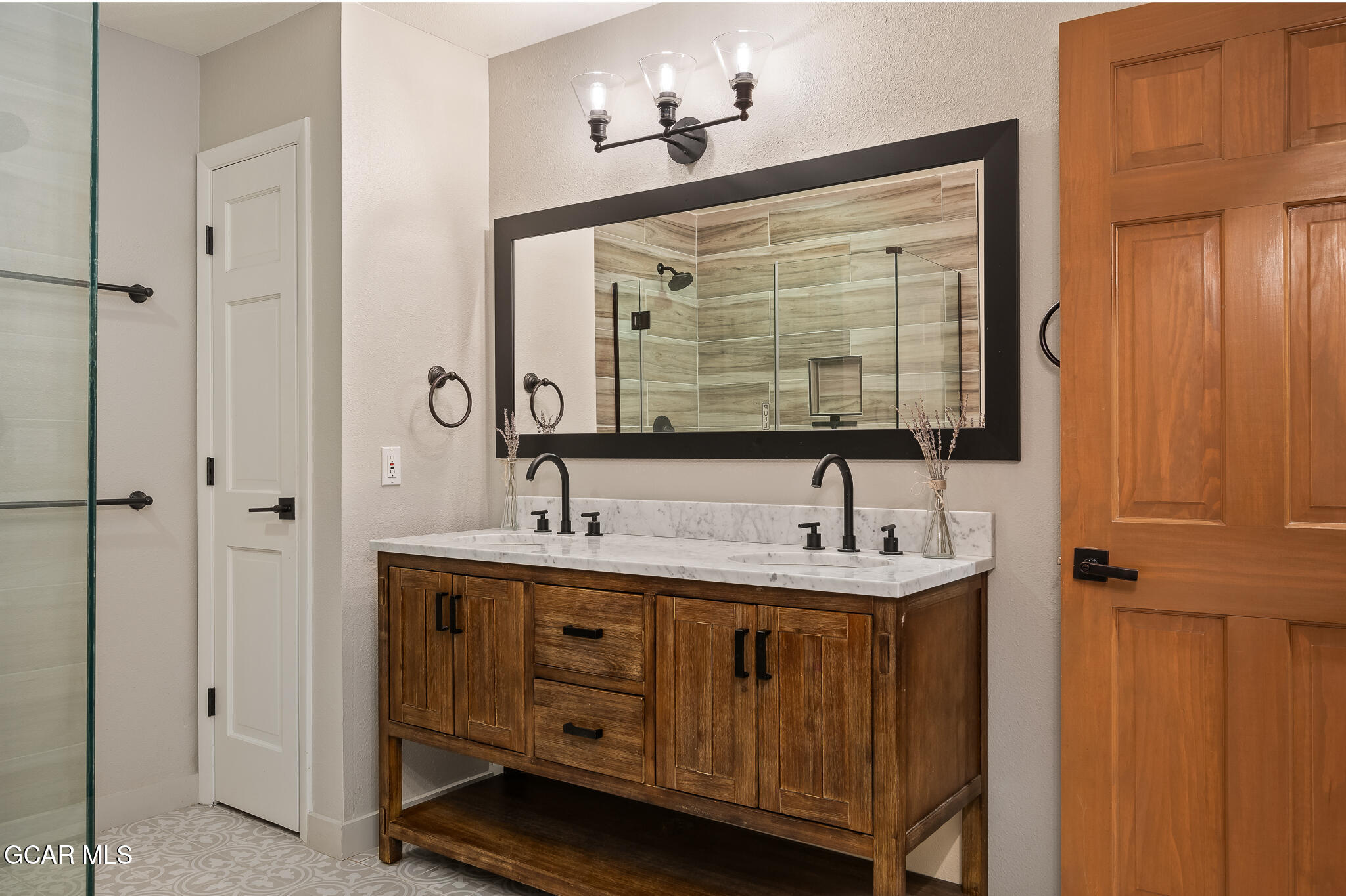 614 Vasquez Road Winter Park, CO 80482 - Photo 24 of 52 a bathroom with a sink and a mirror