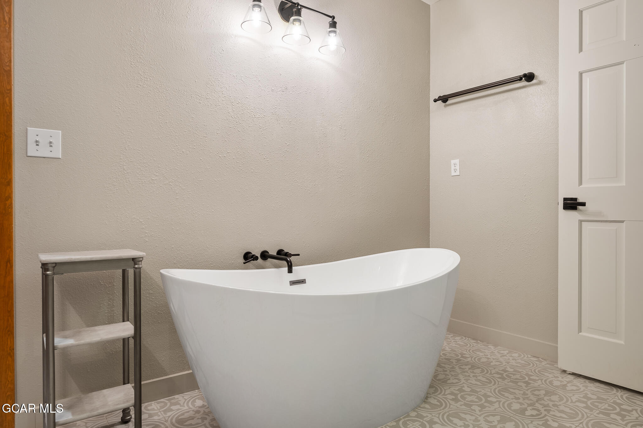 614 Vasquez Road Winter Park, CO 80482 - Photo 26 of 52 a white bath tub sitting in a bathroom