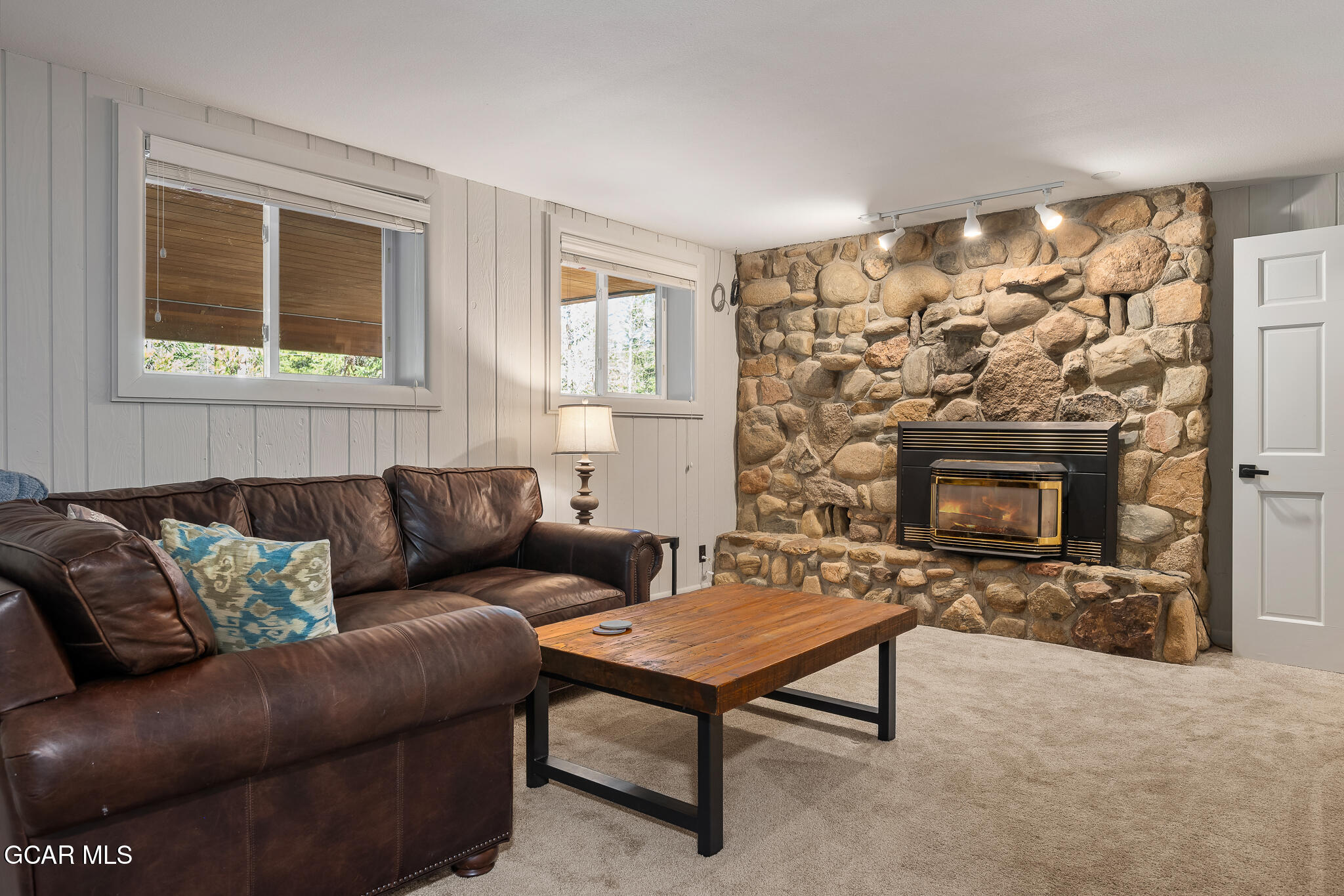 614 Vasquez Road Winter Park, CO 80482 - Photo 29 of 52 a living room with furniture and a fireplace
