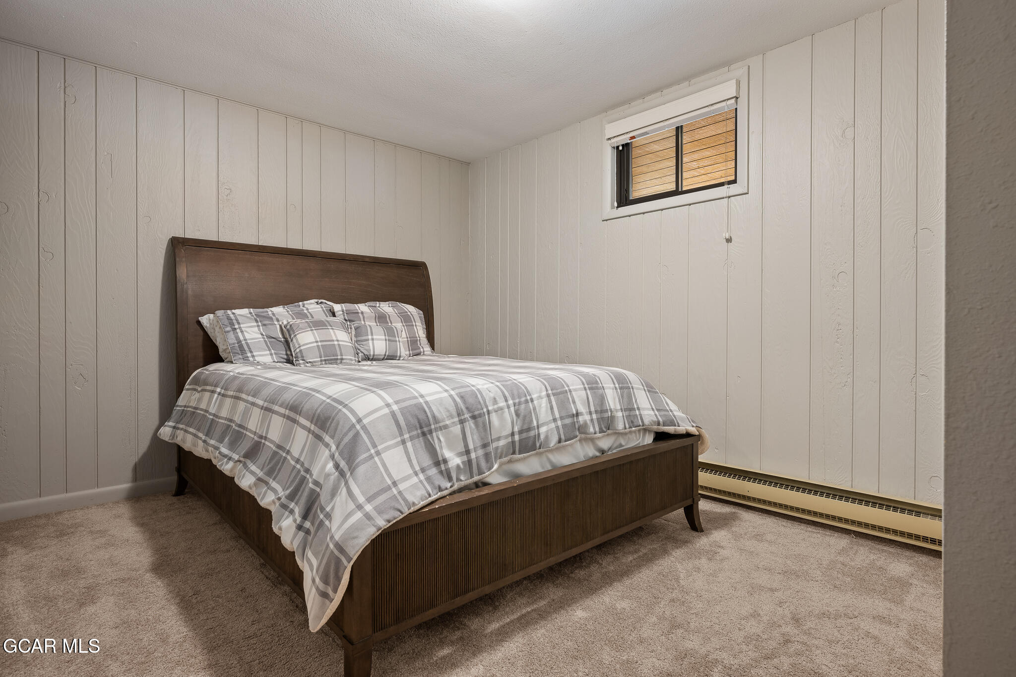 614 Vasquez Road Winter Park, CO 80482 - Photo 30 of 52 a bed sitting in a bedroom next to a window