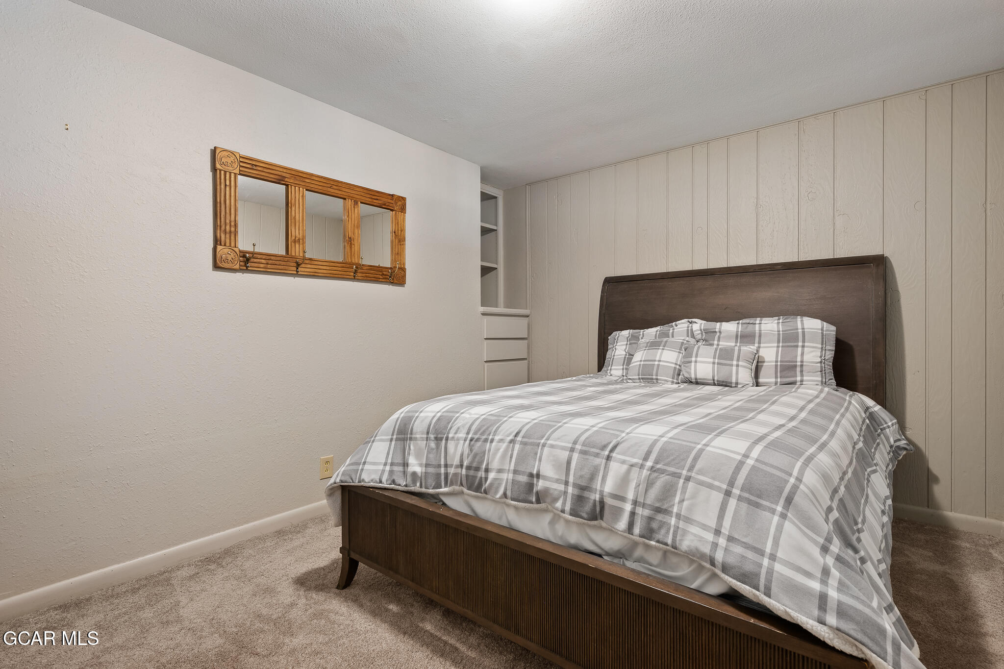 614 Vasquez Road Winter Park, CO 80482 - Photo 31 of 52 a bedroom with a bed and a lamp on dresser