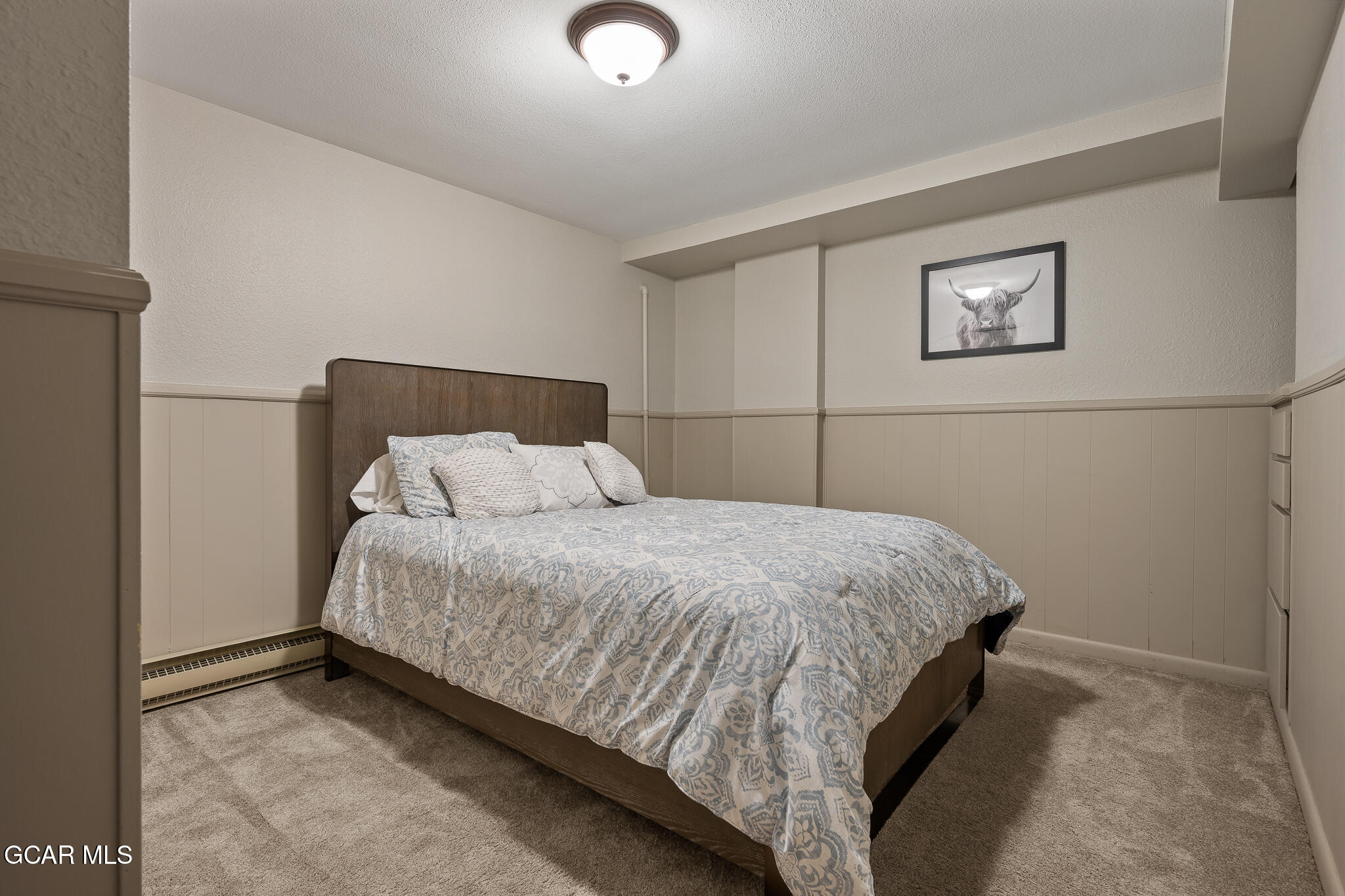 614 Vasquez Road Winter Park, CO 80482 - Photo 34 of 52 a bedroom with a bed and a desk