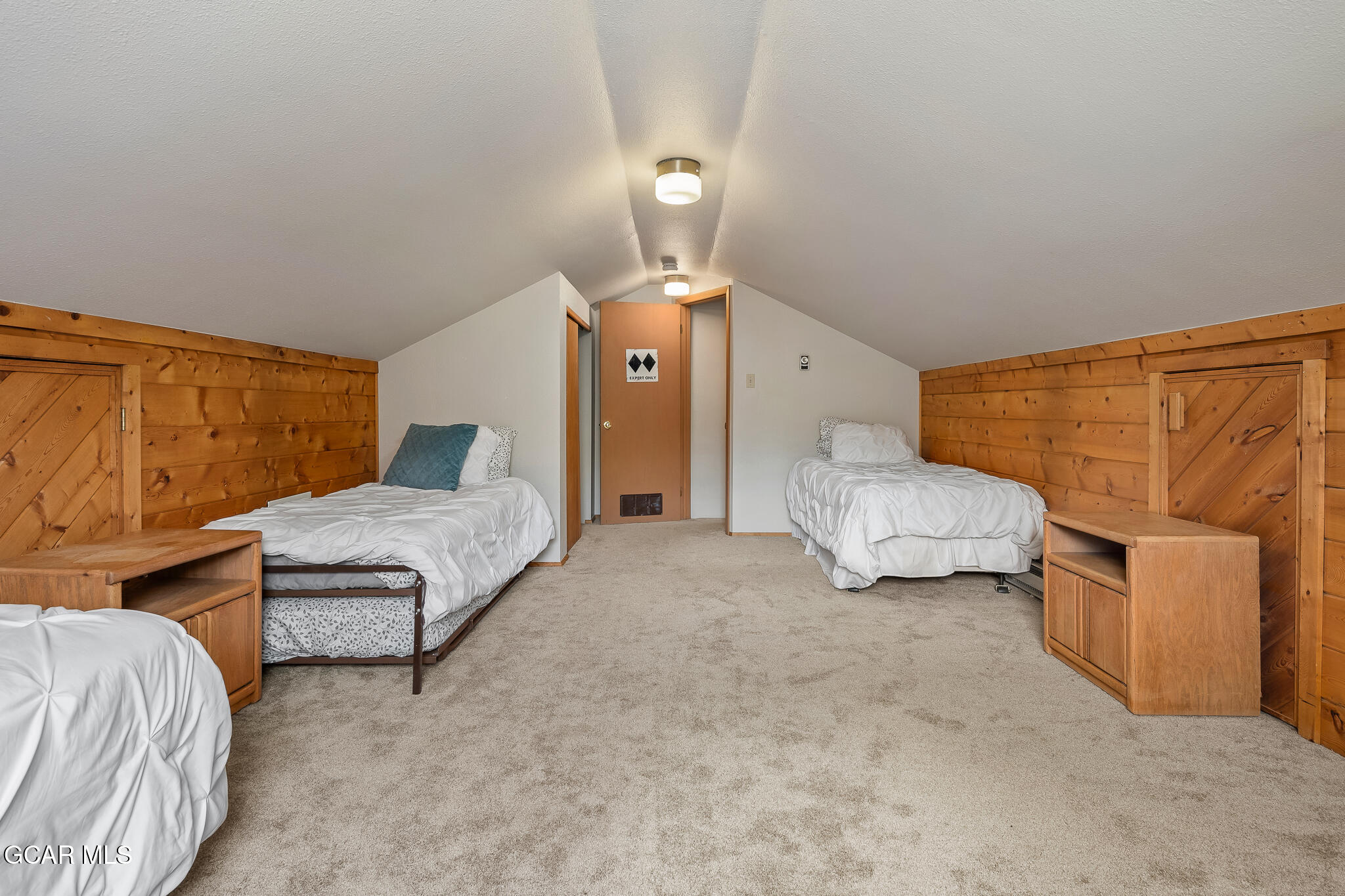 614 Vasquez Road Winter Park, CO 80482 - Photo 39 of 52 a spacious bedroom with a bed and ceiling fan