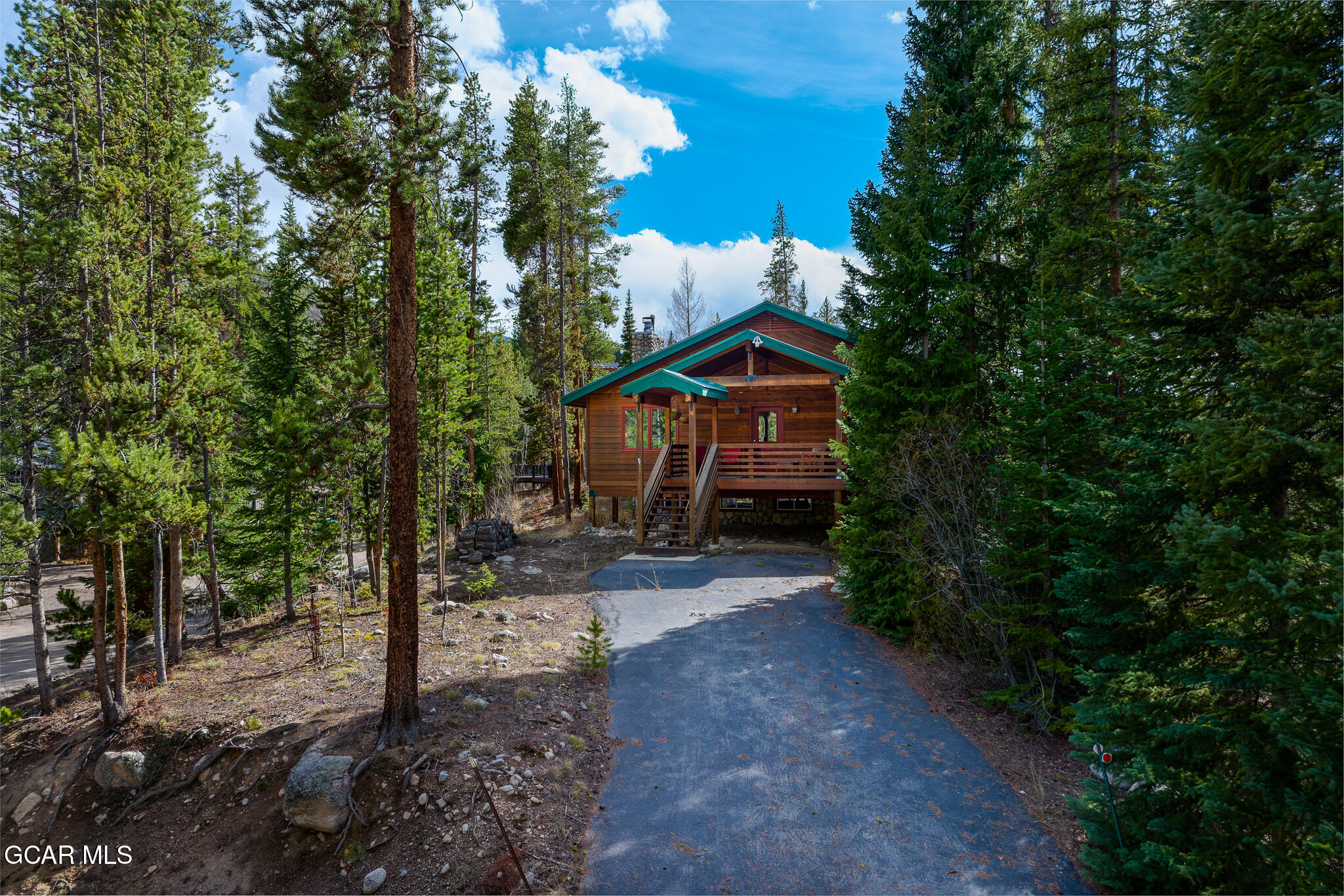 614 Vasquez Road Winter Park, CO 80482 - Photo 48 of 52 a view of a house with a yard