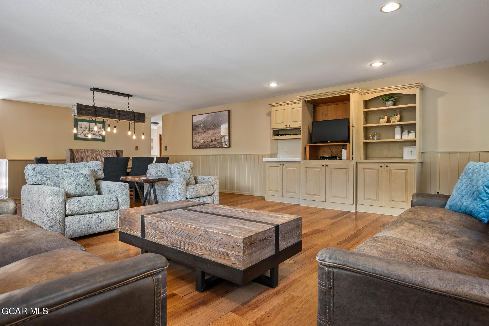614 Vasquez Road Winter Park, CO 80482 - Photo 5 of 52 a living room with furniture and a flat screen tv