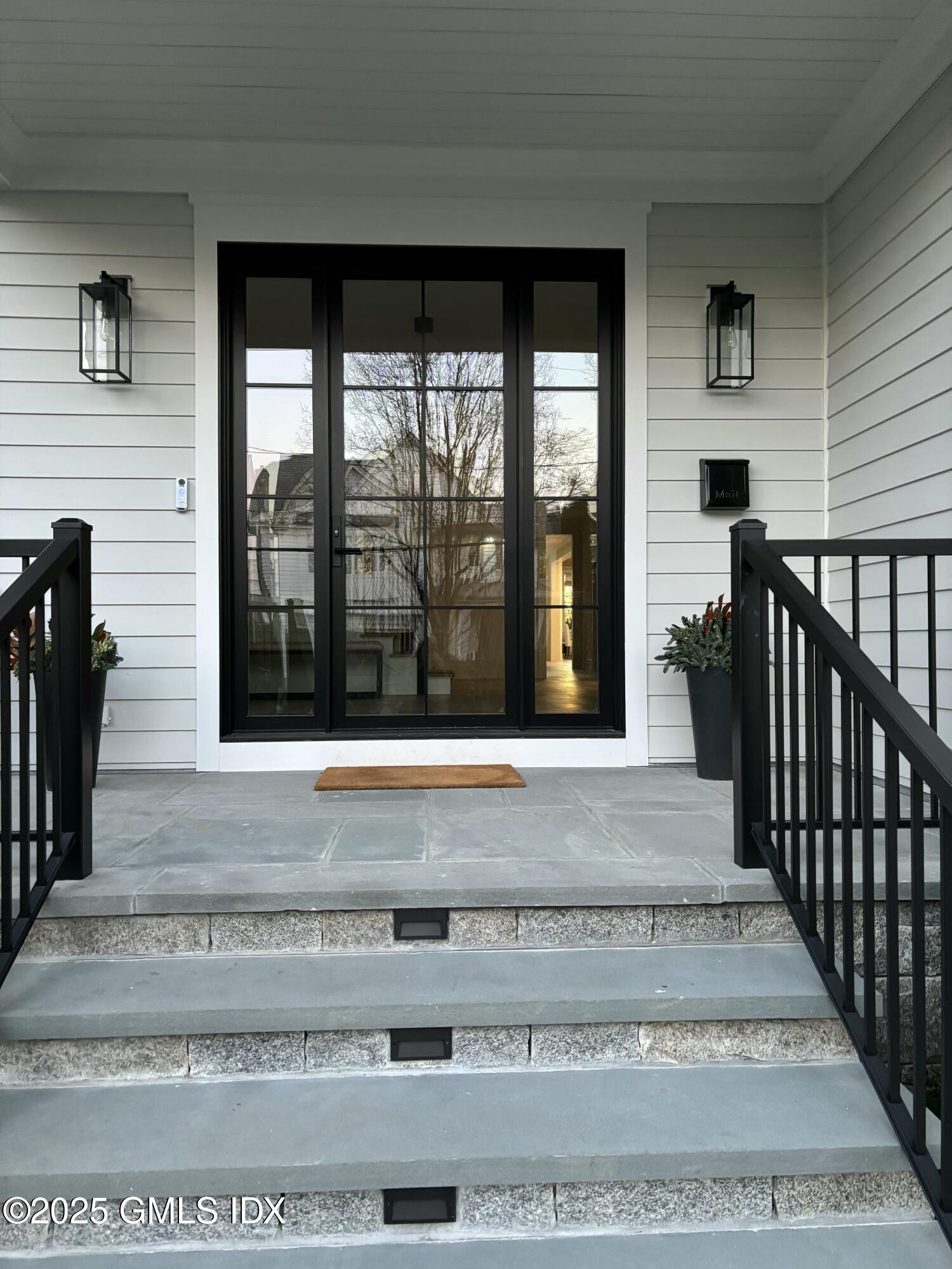 119 Havemeyer Place Greenwich, CT 06830 - Photo 1 of 7 a view of a entryway door front of house