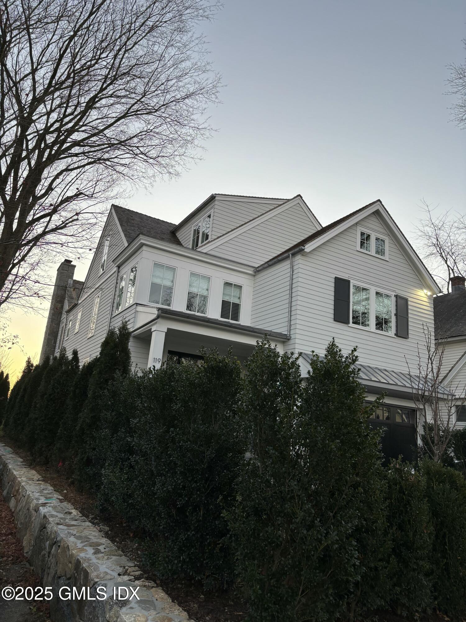 119 Havemeyer Place Greenwich, CT 06830 - Photo 2 of 7 a view of house with garden