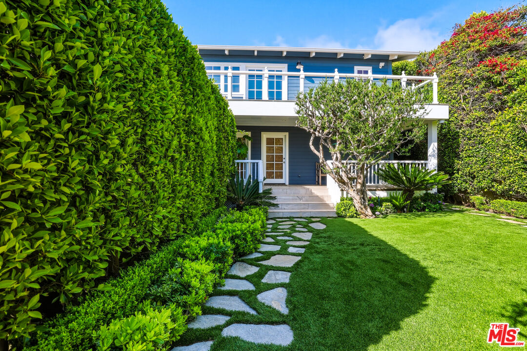 30810 Broad Beach Road Malibu, CA 90265 - Photo 51 of 55 a front view of a house with a garden
