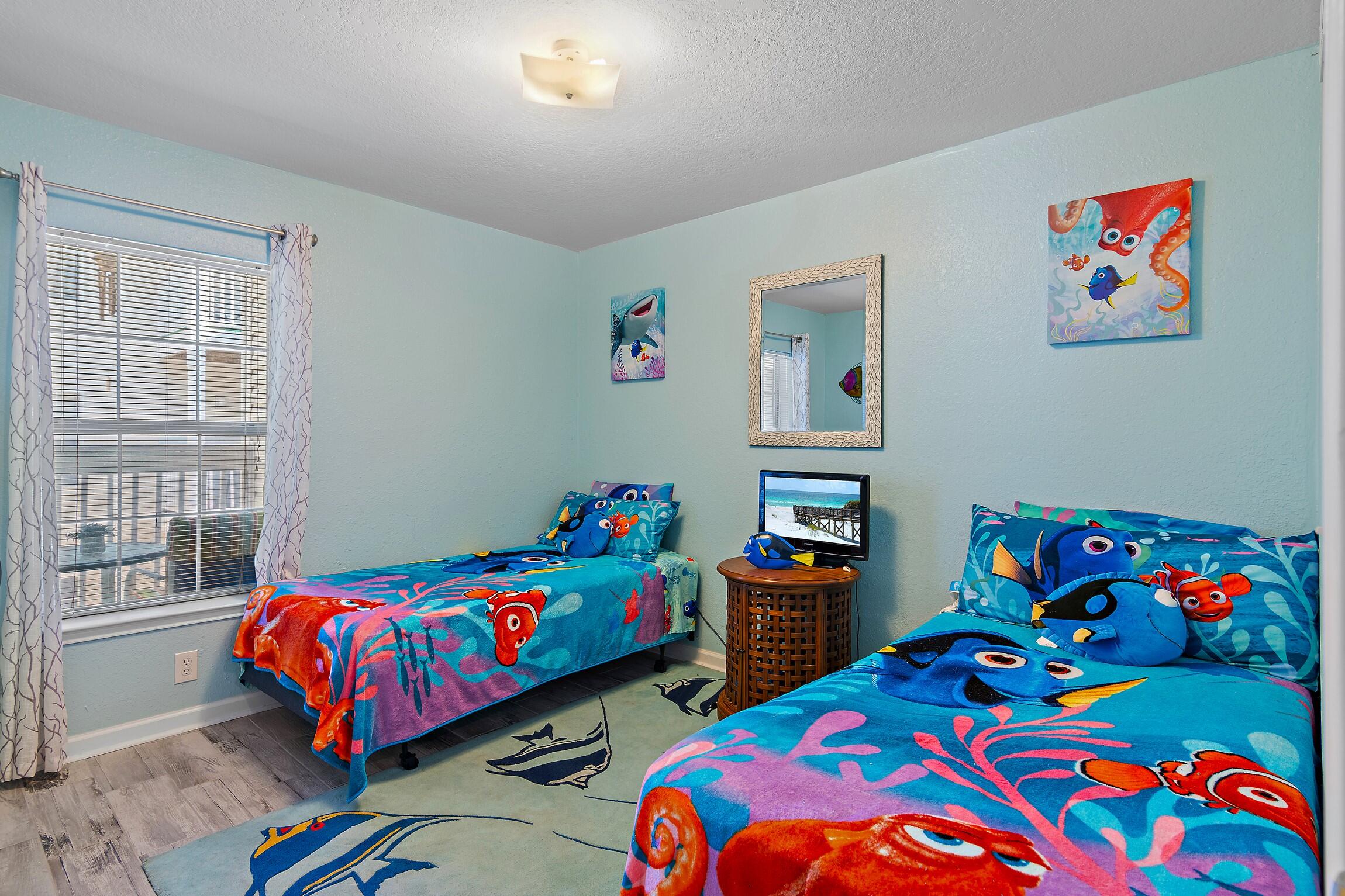 4010 Dancing Cloud Court, Unit 404 Destin, FL 32541 - Photo 11 of 44 a bedroom with two beds and a wooden floor
