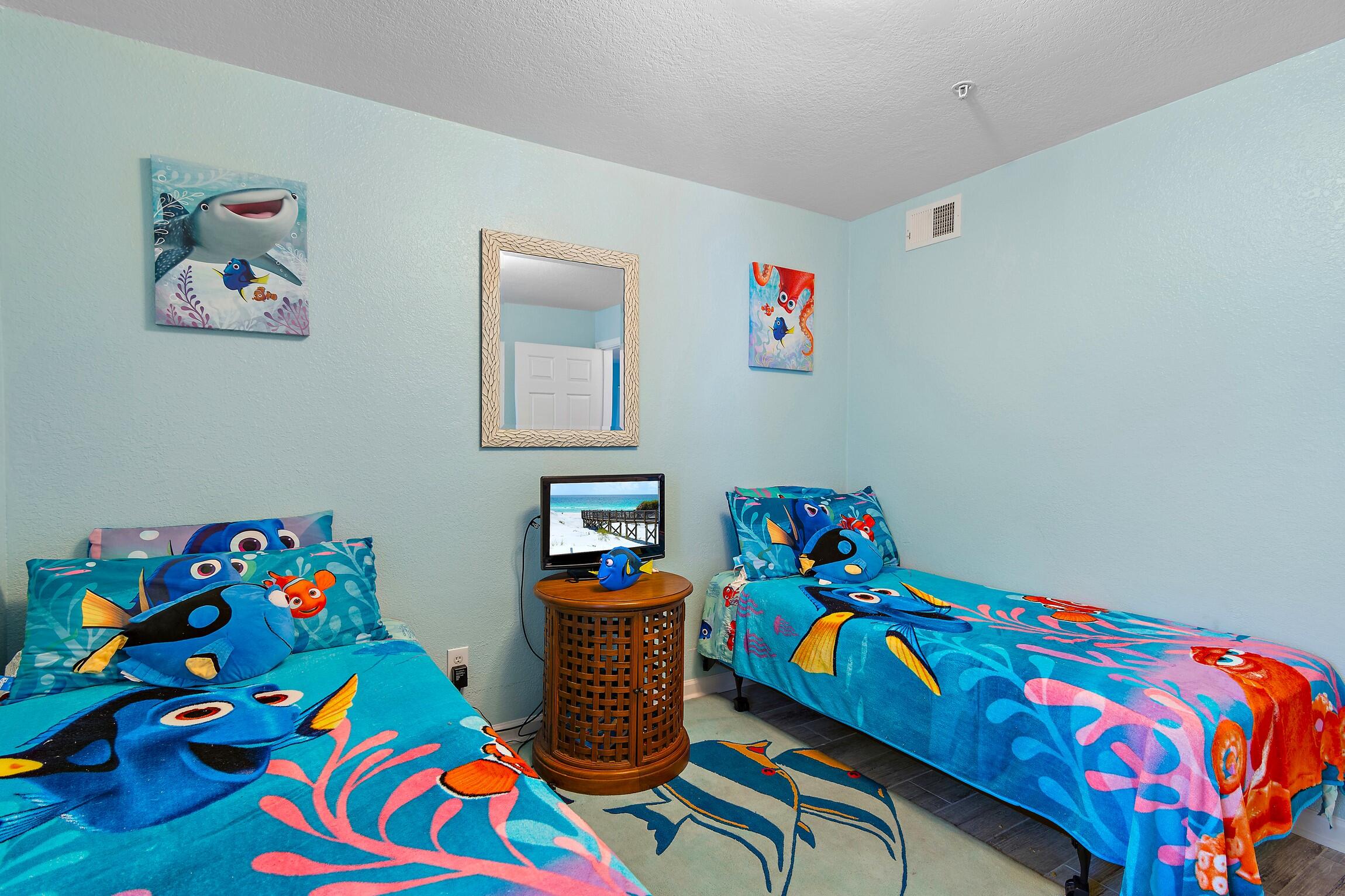 4010 Dancing Cloud Court, Unit 404 Destin, FL 32541 - Photo 20 of 44 a bedroom with toys and wooden play table