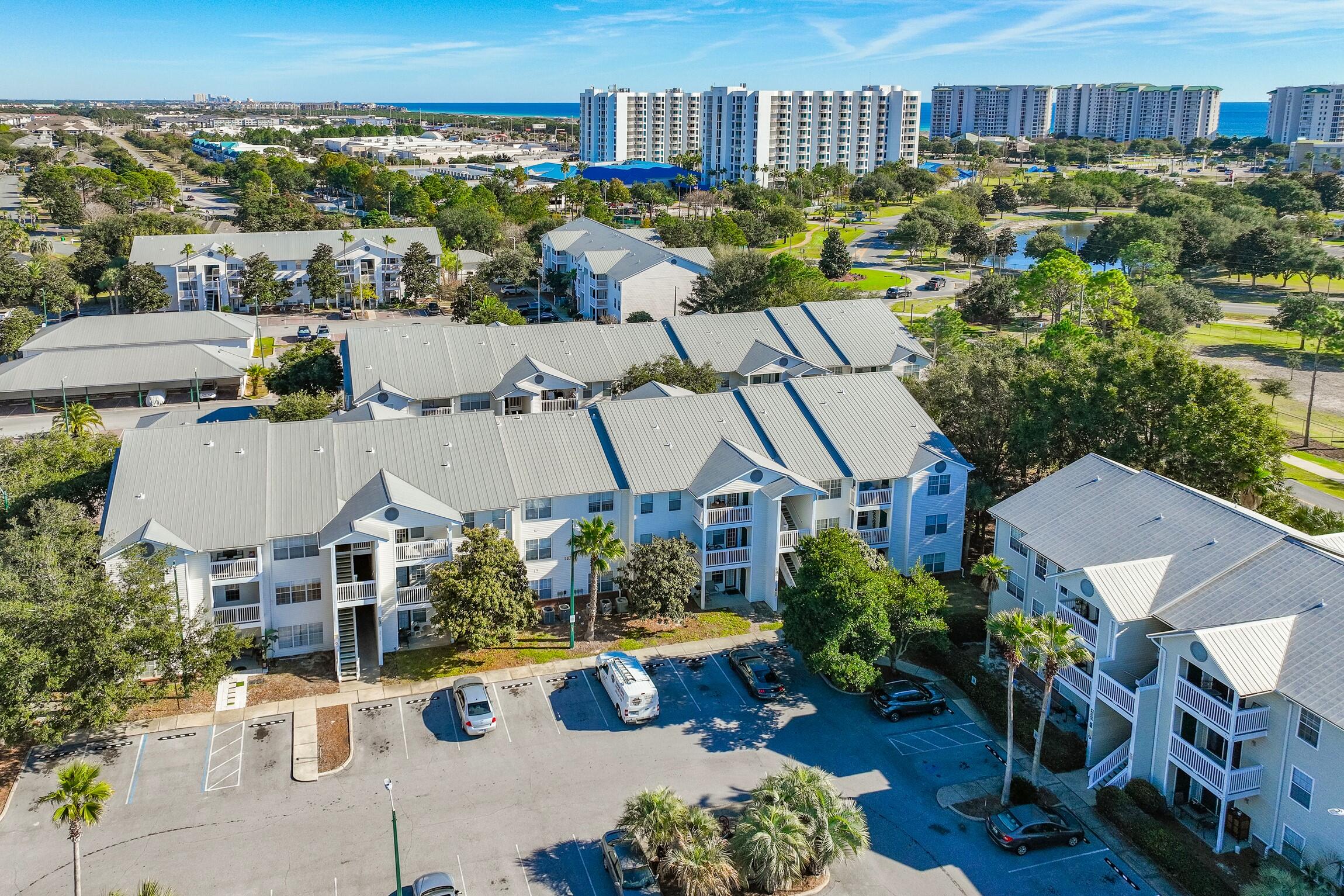 4010 Dancing Cloud Court, Unit 404 Destin, FL 32541 - Photo 34 of 44 an aerial view of multiple houses with yard