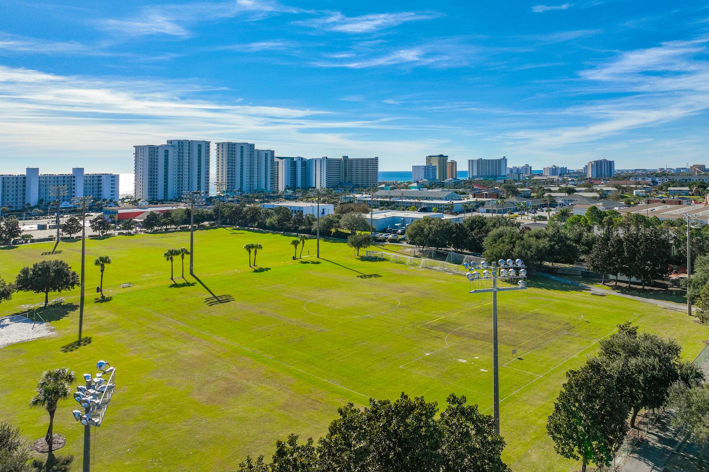 4010 Dancing Cloud Court, Unit 404 Destin, FL 32541 - Photo 36 of 44 a view of a swimming pool with a chairs