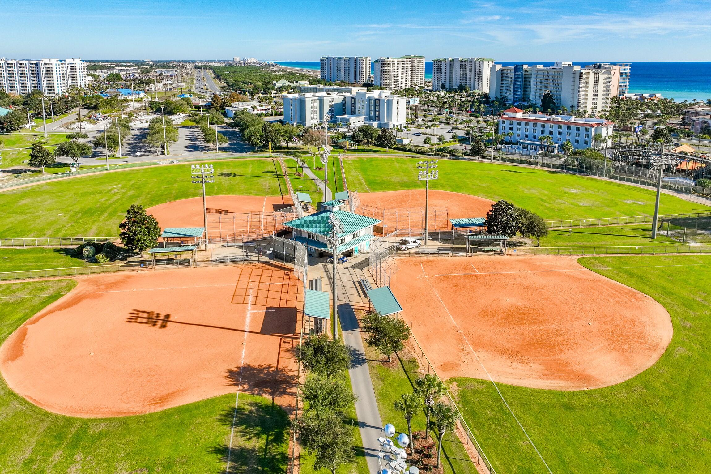 4010 Dancing Cloud Court, Unit 404 Destin, FL 32541 - Photo 38 of 44 an aerial view of residential houses with outdoor space and swimming pool