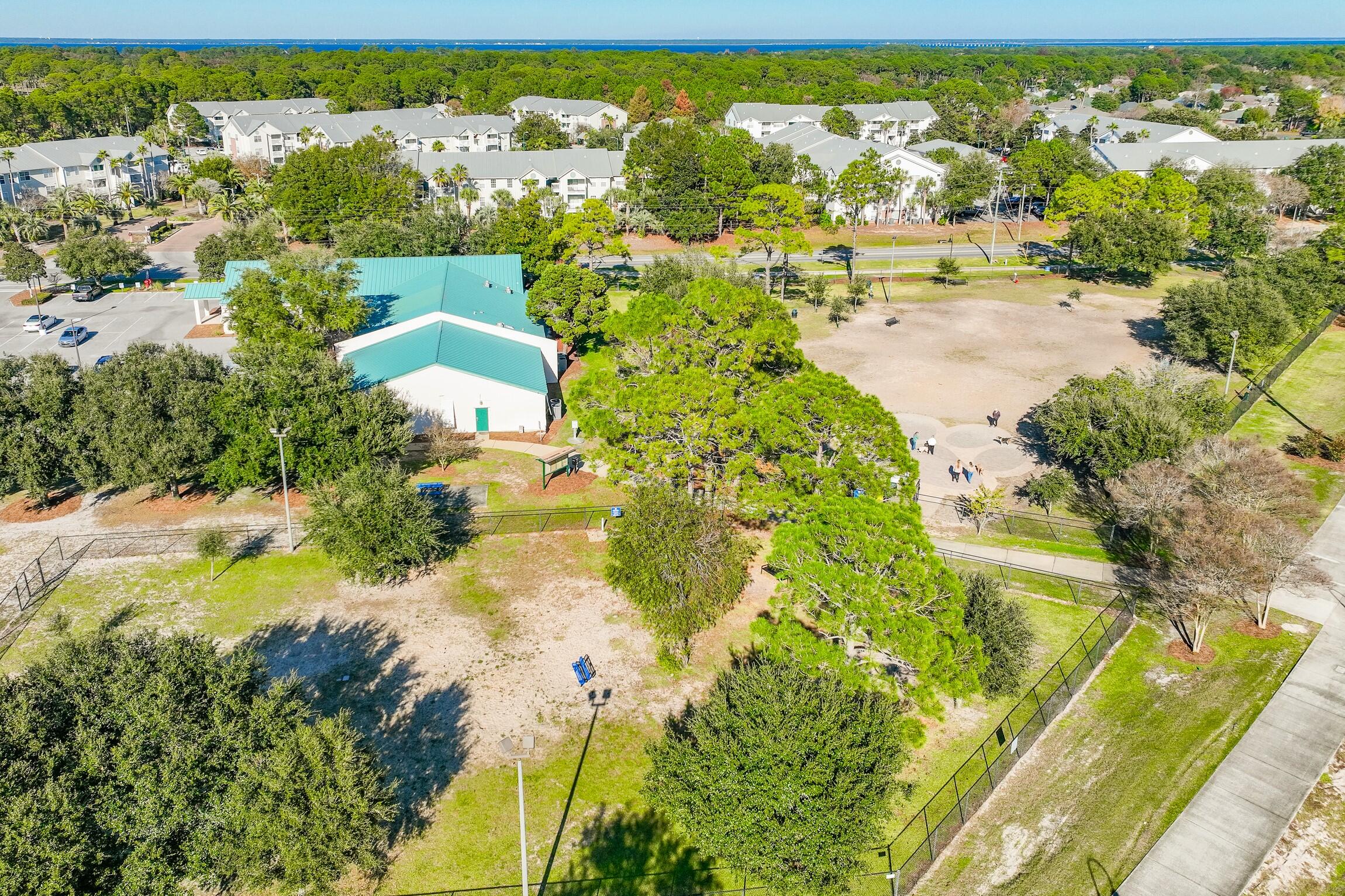 4010 Dancing Cloud Court, Unit 404 Destin, FL 32541 - Photo 40 of 44 an aerial view of residential houses with outdoor space