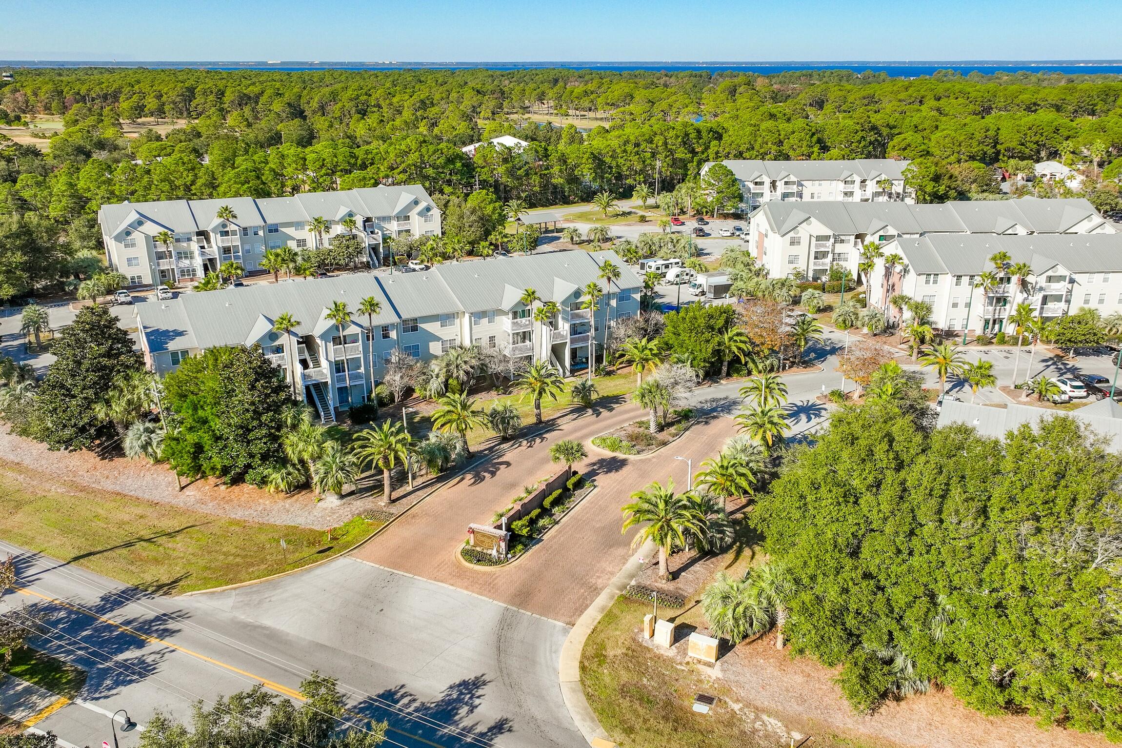 4010 Dancing Cloud Court, Unit 404 Destin, FL 32541 - Photo 8 of 44 an aerial view of a house with a swimming pool