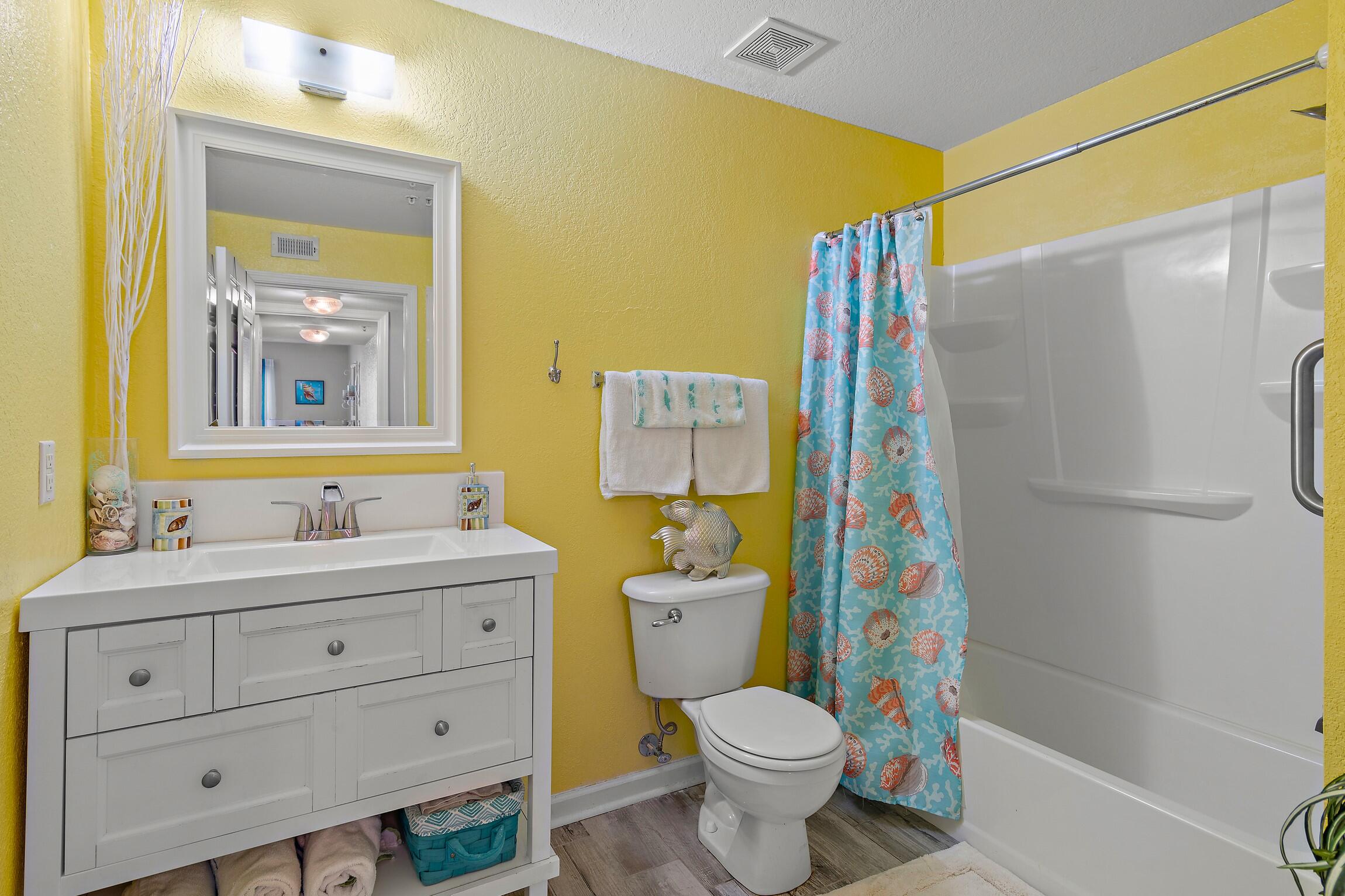 4010 Dancing Cloud Court, Unit 404 Destin, FL 32541 - Photo 10 of 44 a bathroom with a sink toilet and shower