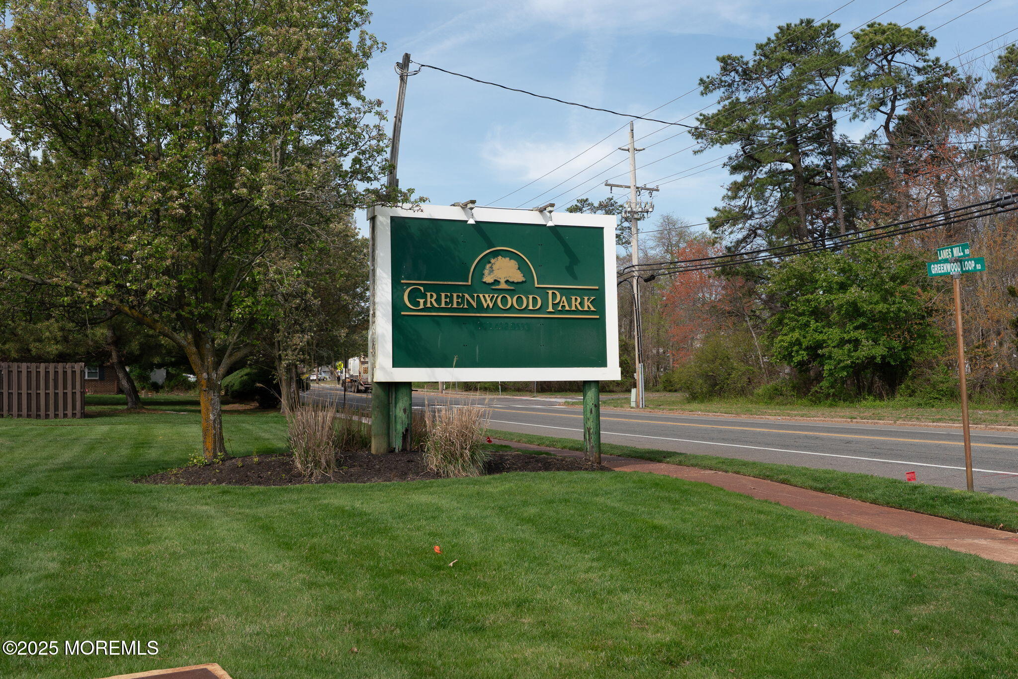 156 Greenwood Loop Road Brick, NJ 08724 - Photo 22 of 22 a sign on the side of the road