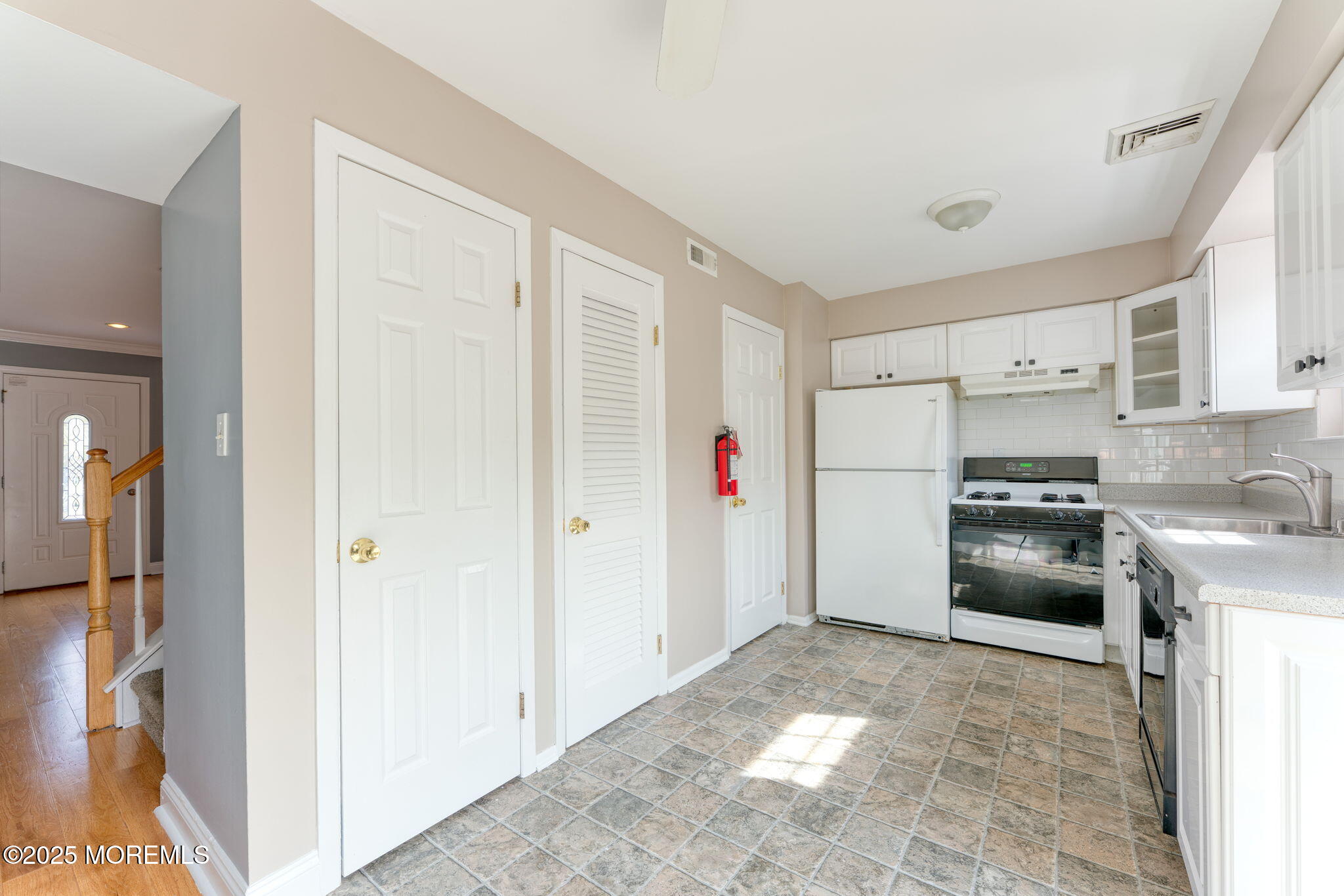 156 Greenwood Loop Road Brick, NJ 08724 - Photo 6 of 22 a kitchen with granite countertop a refrigerator and a sink