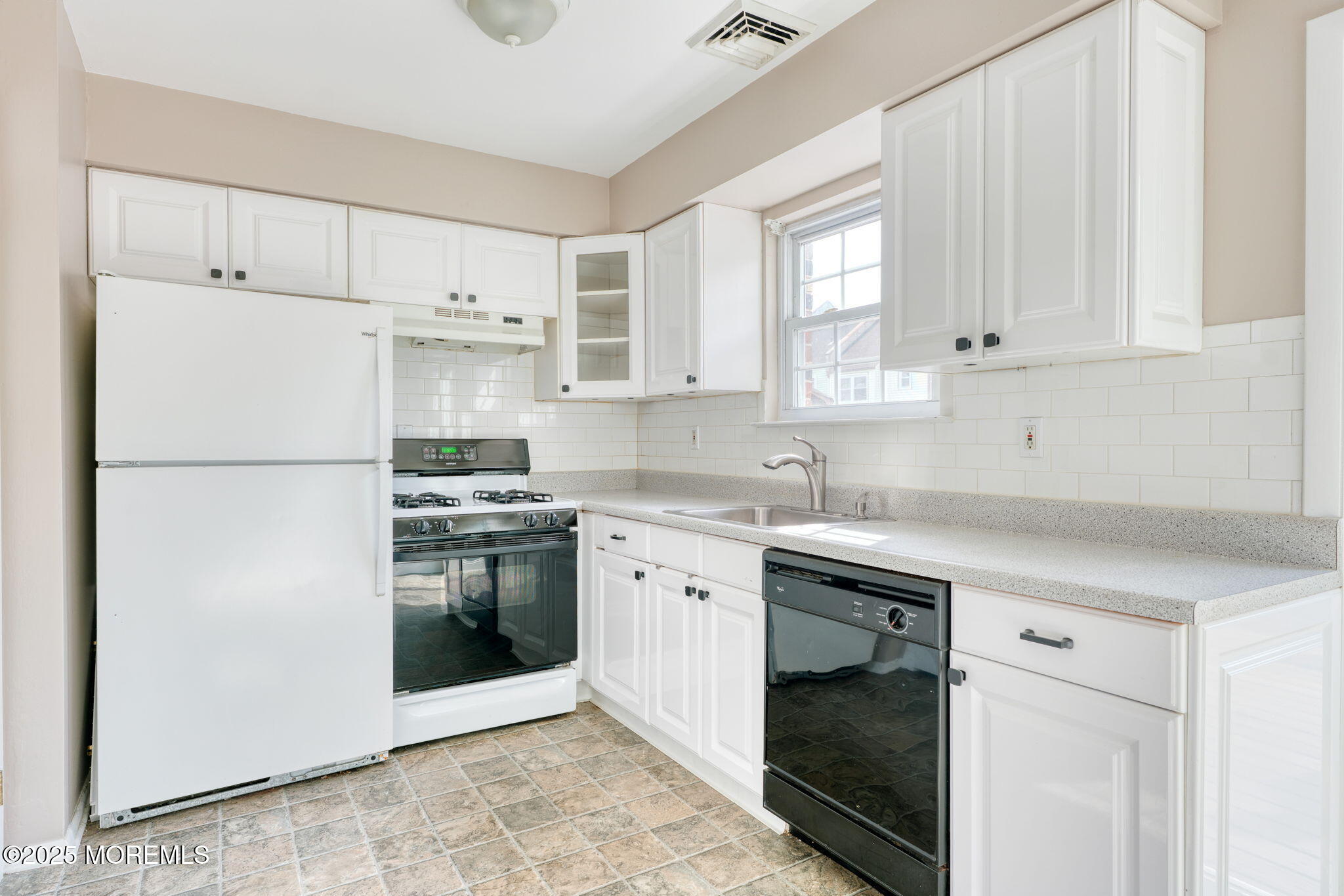 156 Greenwood Loop Road Brick, NJ 08724 - Photo 7 of 22 a kitchen with white cabinets and white appliances