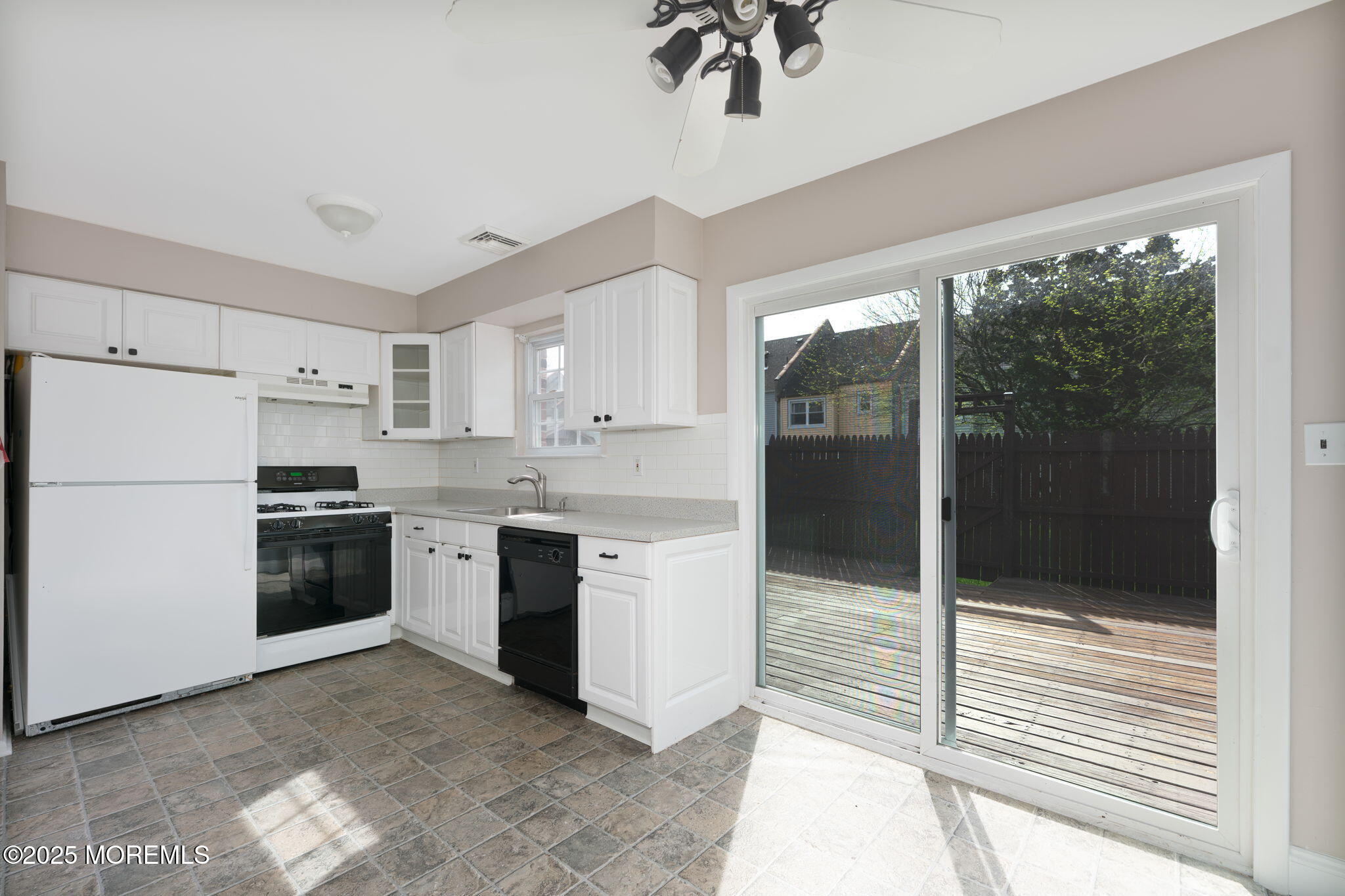 156 Greenwood Loop Road Brick, NJ 08724 - Photo 9 of 22 a kitchen with a refrigerator and a stove