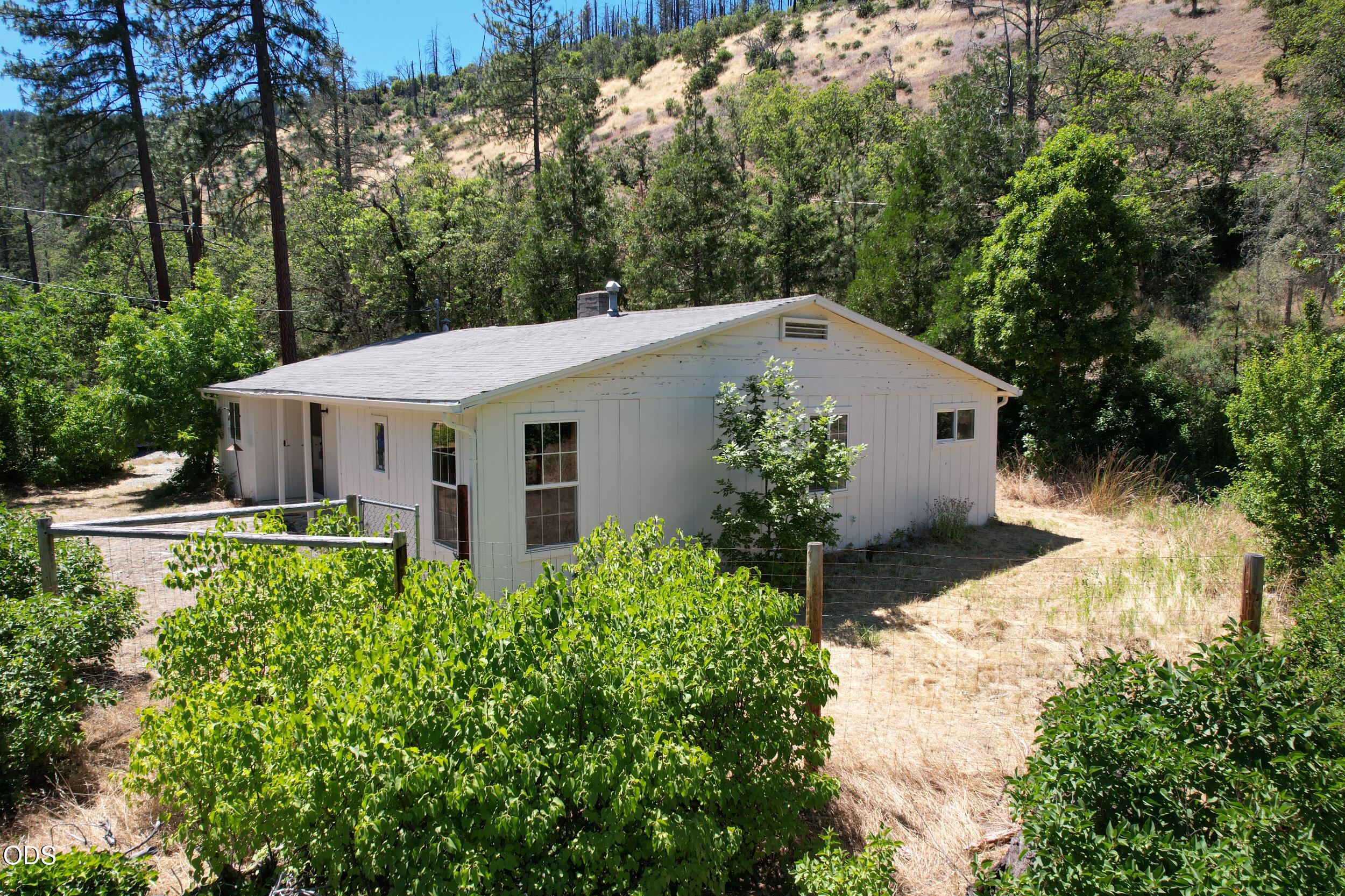 2525 Kinney Creek Road Jacksonville, OR 97530 - Photo 5 of 38 a aerial view of a house with yard and trees in the background