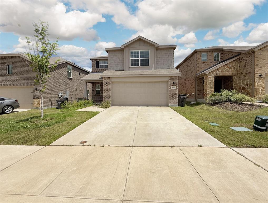 a view of a white house with a yard