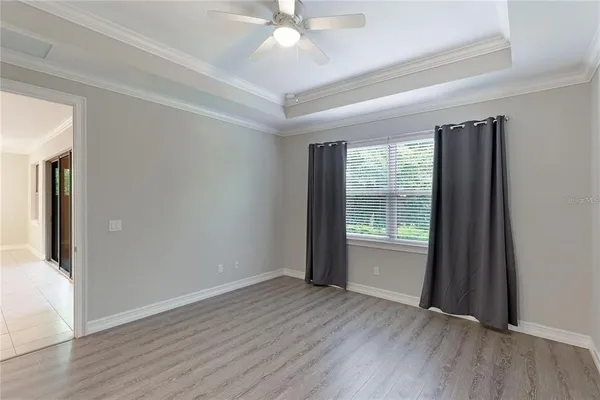 a spacious bathroom with a granite countertop sink a toilet and shower