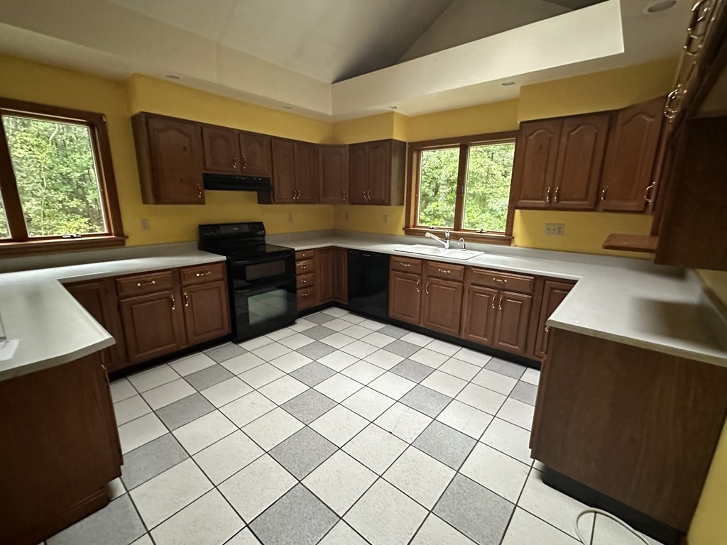 179 Mixter Road Holden, MA 01520 - Photo 3 of 8 a kitchen with stainless steel appliances kitchen island granite countertop a sink dishwasher stove and cabinets