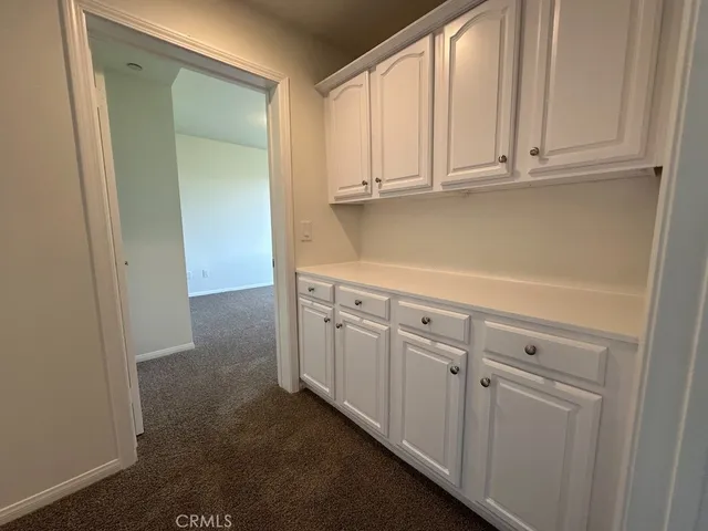 a view of cabinets and window