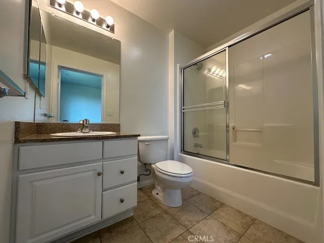 a bathroom with a toilet a sink and shower