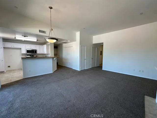 a view of a kitchen with a sink