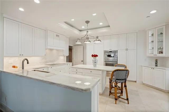 a kitchen with stainless steel appliances granite countertop a sink and cabinets