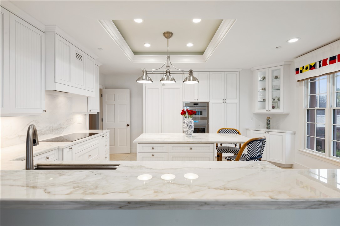 90 Beachside Drive, Unit 101 Vero Beach, FL 32963 - Photo 13 of 29 a living room with furniture and a chandelier