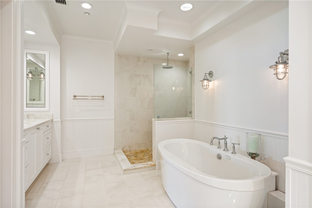 90 Beachside Drive, Unit 101 Vero Beach, FL 32963 - Photo 17 of 29 a bathroom with a bathtub sink and toilet