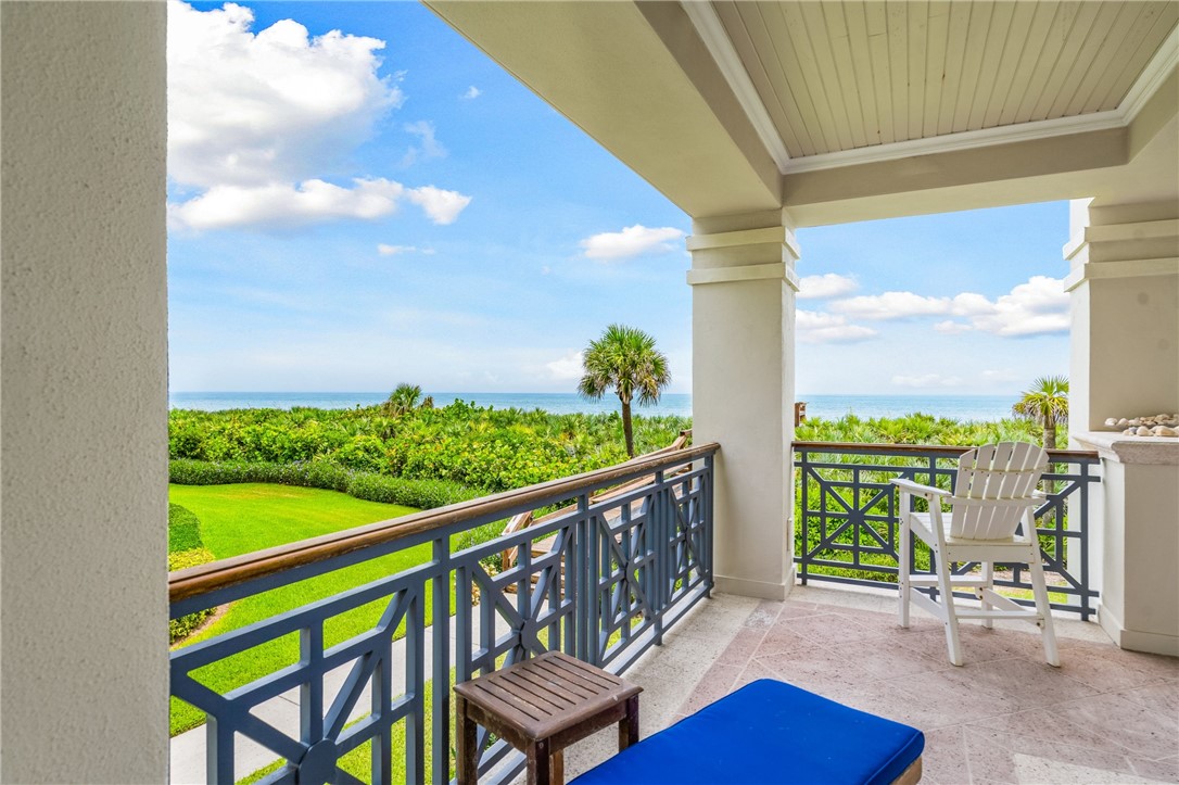 90 Beachside Drive, Unit 101 Vero Beach, FL 32963 - Photo 22 of 29 a view of a chairs and table in the balcony
