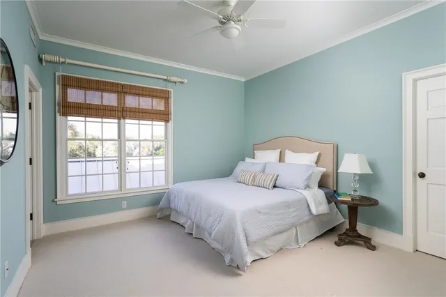 a bedroom with two beds and a window