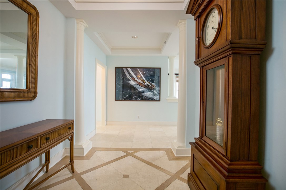 90 Beachside Drive, Unit 101 Vero Beach, FL 32963 - Photo 5 of 29 a view of a hallway with entryway wooden floor and front door