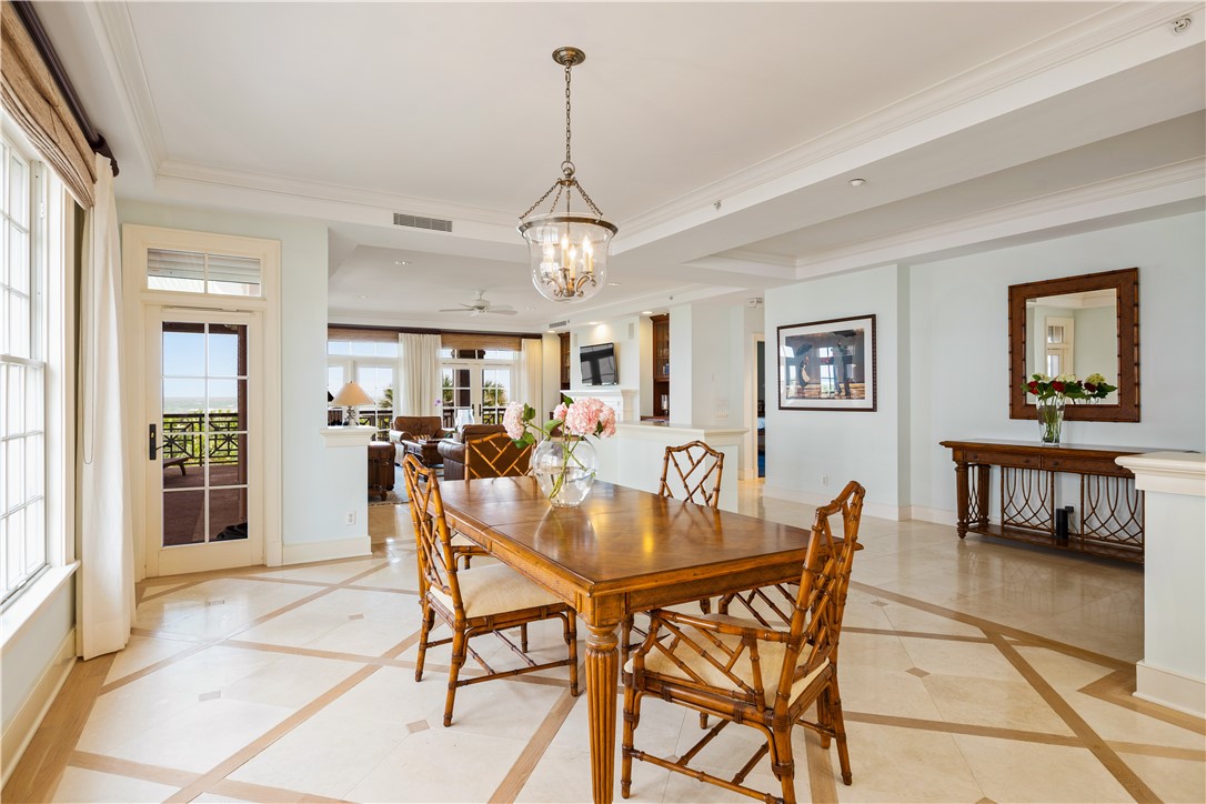 90 Beachside Drive, Unit 101 Vero Beach, FL 32963 - Photo 9 of 29 a view of a dining room with furniture window and wooden floor