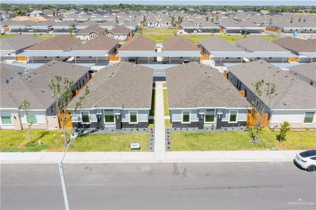 an aerial view of a house with a swimming pool