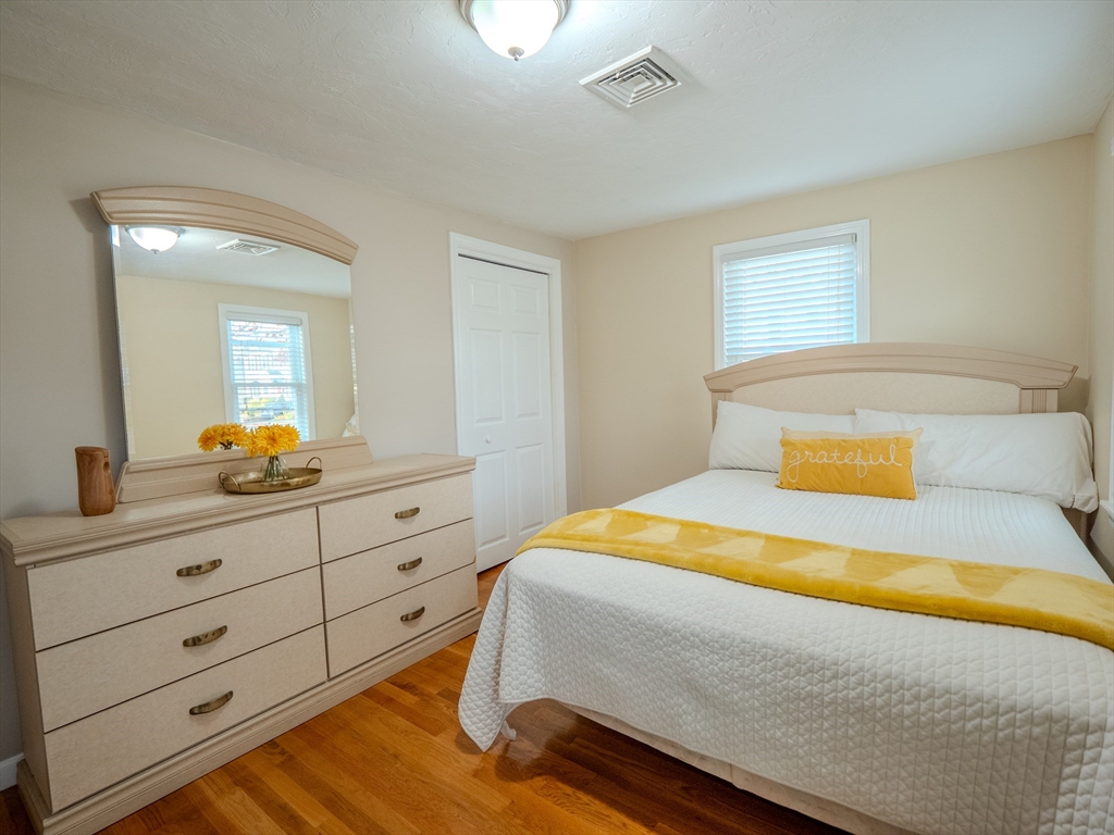 51 Lancaster Road Dedham, MA 02026 - Photo 26 of 41 a bedroom with a bed and a dresser