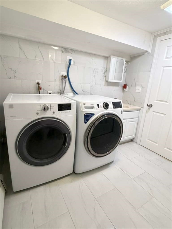51 Lancaster Road Dedham, MA 02026 - Photo 36 of 41 a utility room with dryer and washer