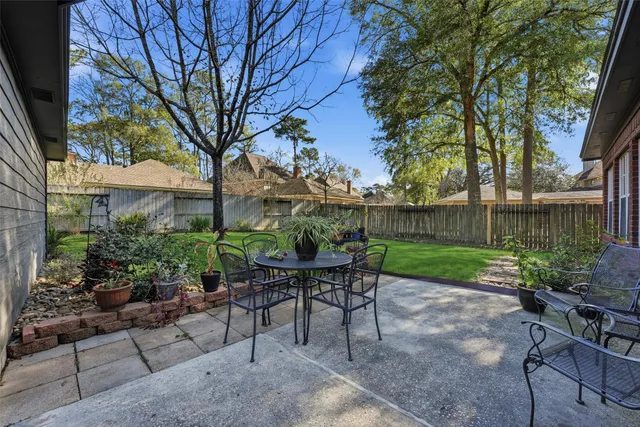 a view of backyard with seating and green space