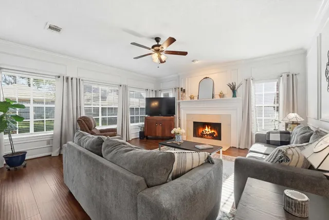 a living room with furniture and a fireplace